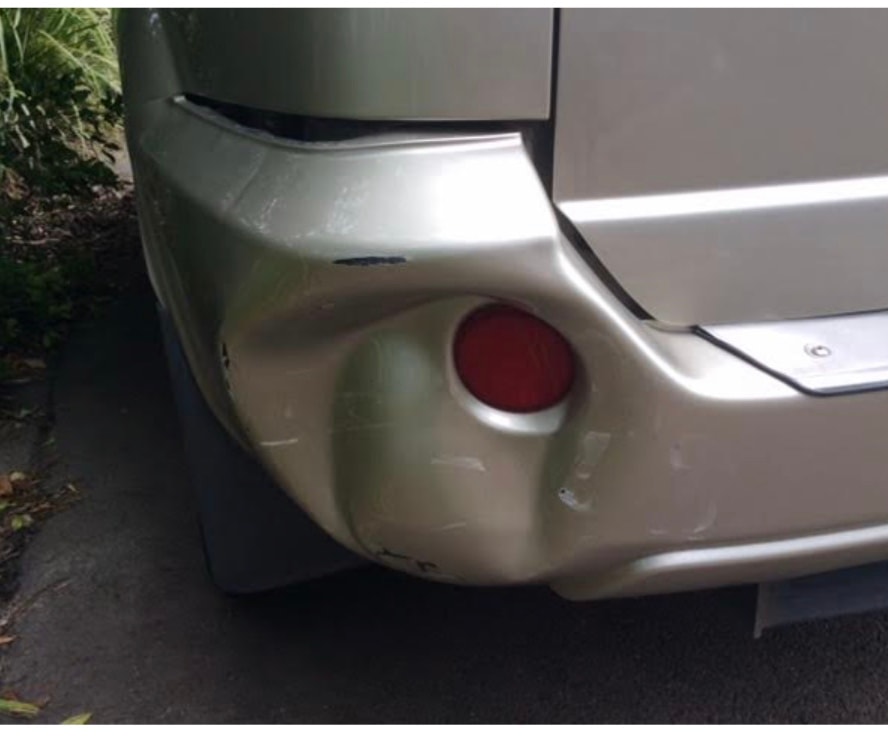 Before — Bumper dent
