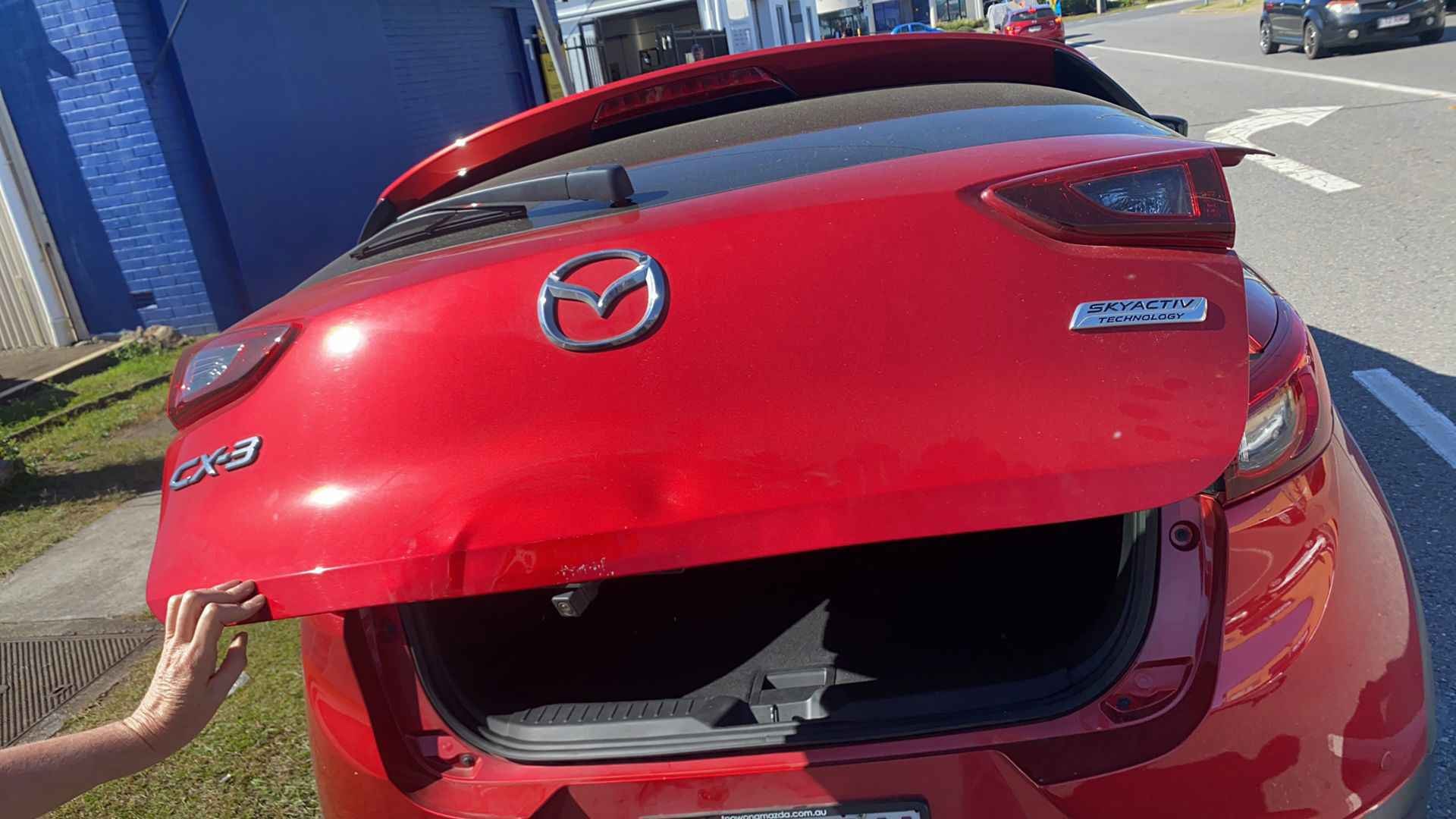 Before — Tailgate dent